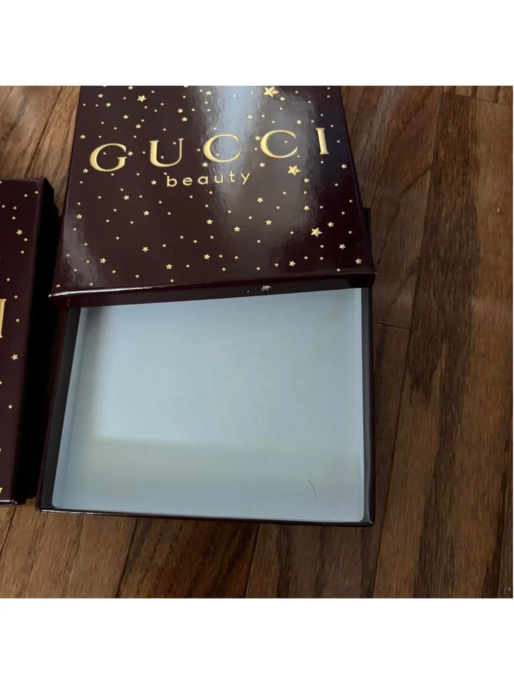 Gucci Beauty makeup boxes with gold stars on a dark background Set of 2 empty Gu